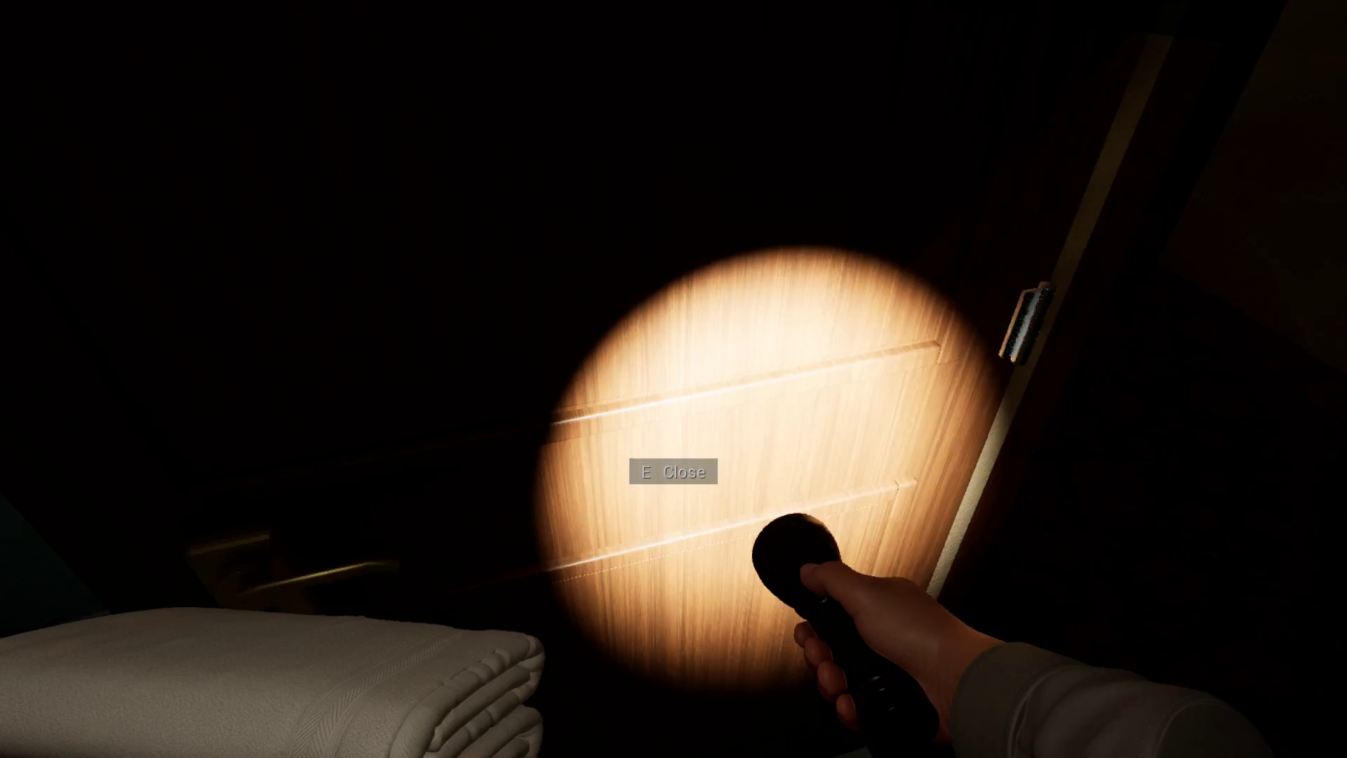 Flashlight on closed hotel guest room door