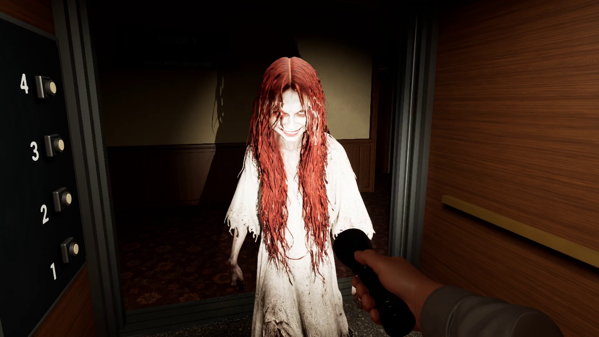 Creature frozen in flashlight beam at elevator doors